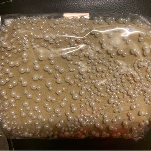 Selling Pearl Clutch.